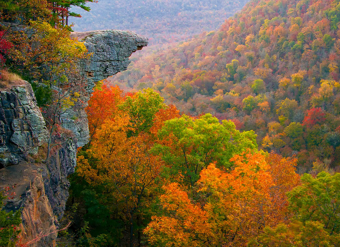 About Our Agency - Aerial view of Hawksbill Crag sunrise in the fall